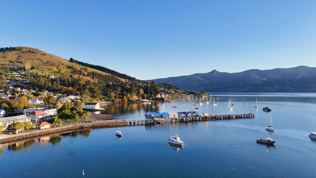 Aerial View of Akaroa Harbor with Boats and Coastal Hills