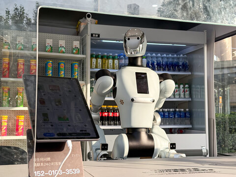 Shanghai, China - November 28, 2025: Humanoid Service Robot as a cashier in Automated Convenience Store selling drinks
