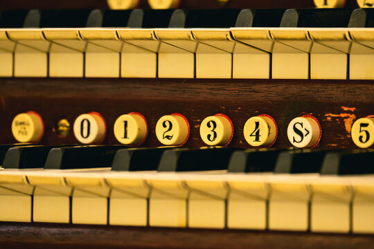 Close-up shot of the keyboard of Boston Emmanuel Casavant Opus 700 pipe organ inside Xiamen Gulangyu Pipe Organ Art Center, showing delicate musical details.