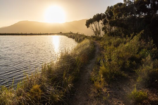 placid pond at sunset, overlooking Klein Mountains, Stanford, South Africa