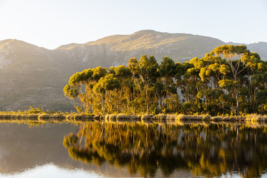 placid pond at sunset, overlooking Klein Mountains, Stanford, South Africa