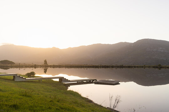 wooden launch, placid pond at sunset, Stanford, South Africa