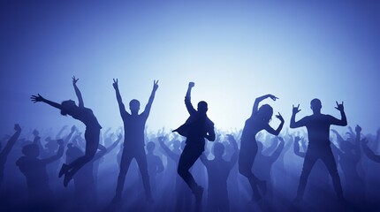 Fototapeta premium Group of people dancing and celebrating at a nighttime concert with hands raised