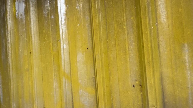 Macro texture of yellow galvalume steel wall cladding for retail shop