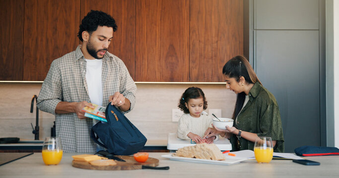 Family, breakfast and bag with toddler in kitchen for morning routine or back to school preparation. Mom, child and dad packing food with books or meal prep for early childhood development in home