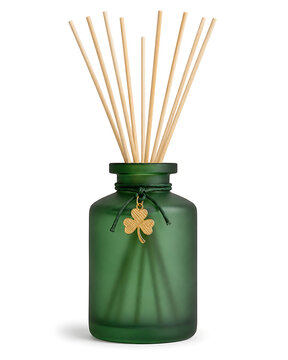 Aromatic diffuser with shamrock charm and natural reeds creating a serene ambiance for home fragrance and decorative appeal evoking a sense of tranquility and well-being. St. Patrick's Day Shamrock Lu