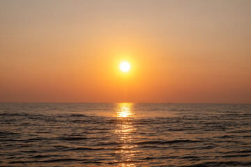 Fototapeta premium Beautiful sunset over the sea. The sun goes down over the sea.