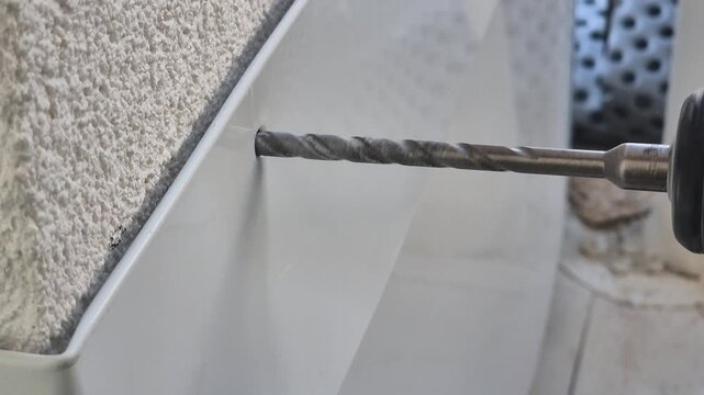 Drilling wind bracing metal plate mounted on post close up