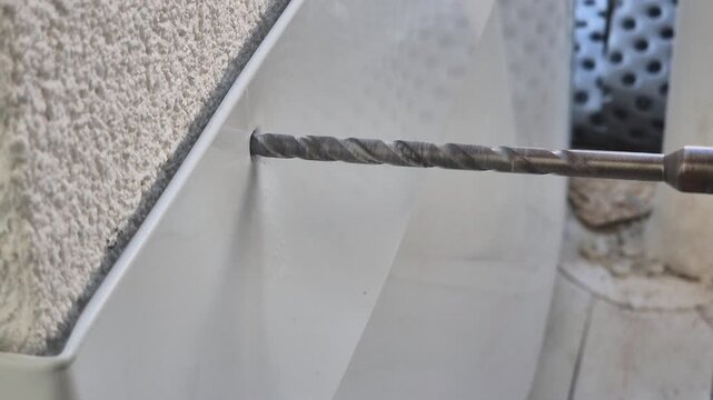 Drilling metal plate mounted on post - Slow Motion