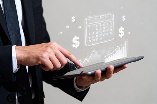 Businessman using tablet with financial data