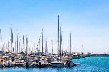 Fototapeta premium Mediterranean Seaside Promenade With Harbor Boats And Blue Waters Bar Montenegro.