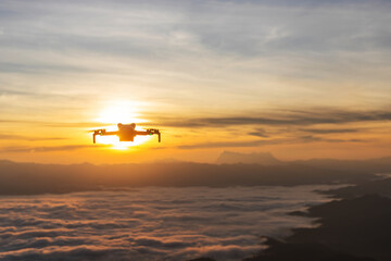 Drone flying over foggy mountains. Aerial view © AungMyo