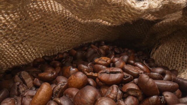 Coffee beans in jute fabric bag.