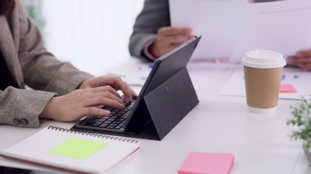 business team meeting collaboration office workspace hands typing tablet computer notebook coffee cup brainstorm planning strategy project management teamwork