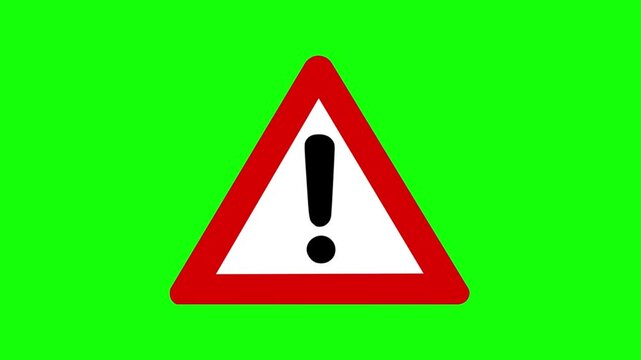 Animated red triangle warning sign with exclamation mark on a green screen for safety alerts.