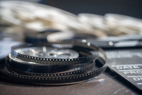 Close-up view on film reel on wooden table. Concept of film production and cinematography.