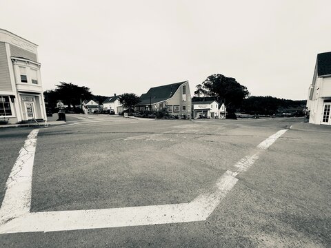 A black and white streetscape photograph looking northeast from the intersection corner of Lansing Street and Ukiah Street in Mendocino, California.