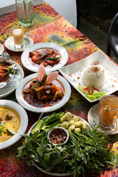 Malaysian Lunch Spread With Asam Pedas And Ulam