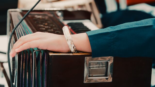 Indian plays Sikh prayer music with harmonium keyboard during Vaisakhi