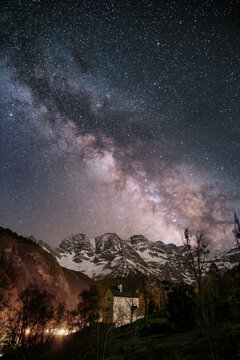 The Milky Way passing over a snow covered Cirque de Gavarnie in the French Pyrenees