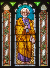 Fototapeta premium MONZA, ITALY - MARCH 19, 2026: The St. Peter the Apostle in the stained glass in church Chiesa della Santissima Trinita degli Artigianelli by unknown artist from end of 19. cent.