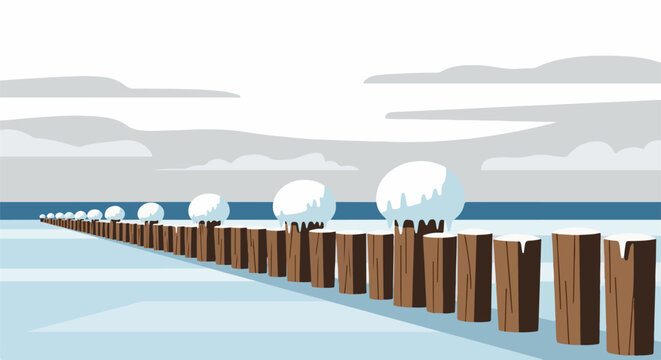 A row of snow-capped posts extends into a winter landscape with a gray sky