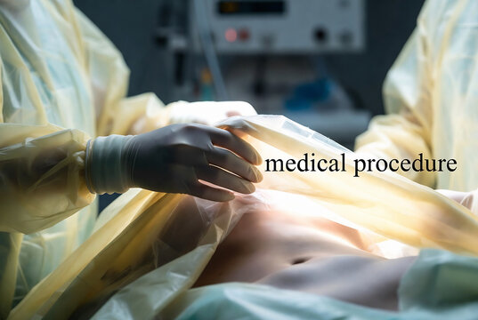 A medical procedure is in progress, likely surgery, within an operating room.