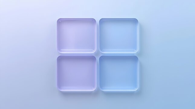 Square plastic trays arranged in a grid formation provide an organized surface for displaying various small objects against a soft blue background.