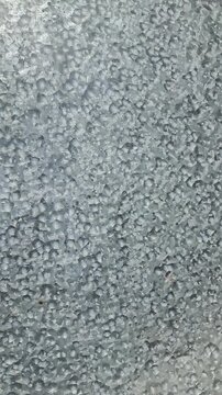 Grey metal surface texture with granular finish, abstract industrial metallic background for engineering and manufacturing design.