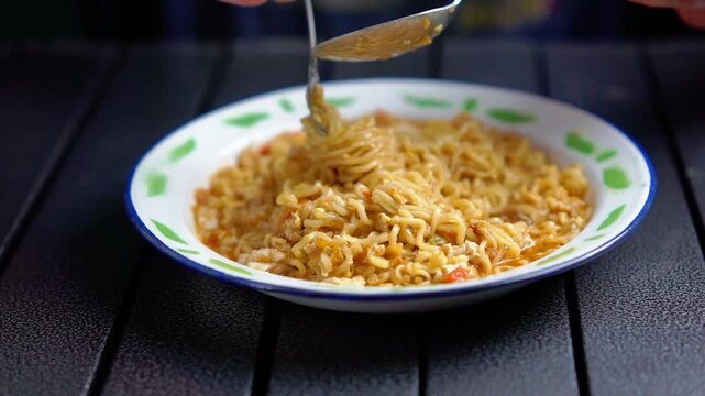 Mie nyemek. An Indonesian noodle dish cooked with a little water, beaten egg, and thick sauce.