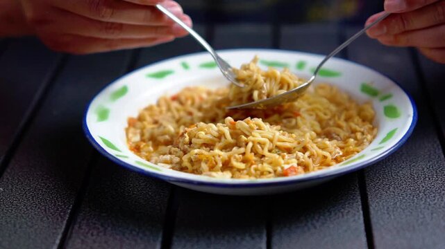 Mie nyemek. An Indonesian noodle dish cooked with a little water, beaten egg, and thick sauce.