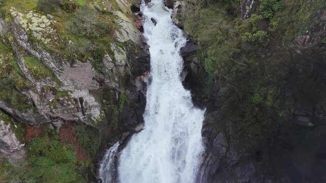 Waterfall Cascading Down On Cliffs In Quint&aacute;s, Silleda, Spain - Drone Shot