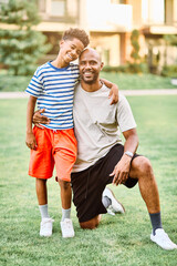Fototapeta premium Portrait of father and son having fun outdoors in park or nature,, family life, parenting, love and bonding concepts