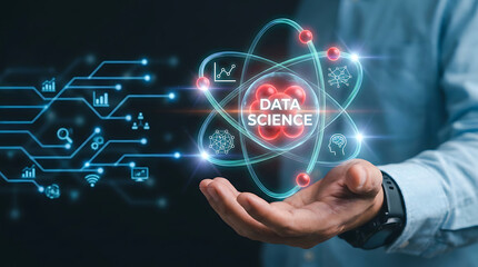 Obraz premium Businessman holding a glowing data science hologram with digital circuit connections and analytical icons for big data technology