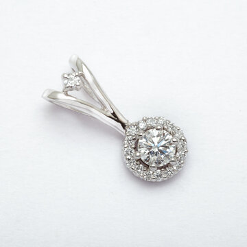 Platinum diamond halo pendant isolated on white background