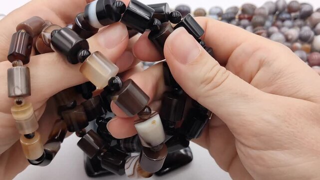 Discover elegant handmade black agate bracelets featuring polished cylindrical beads and unique natural banded gemstone patterns ideal for sophisticated artisan jewelry collections