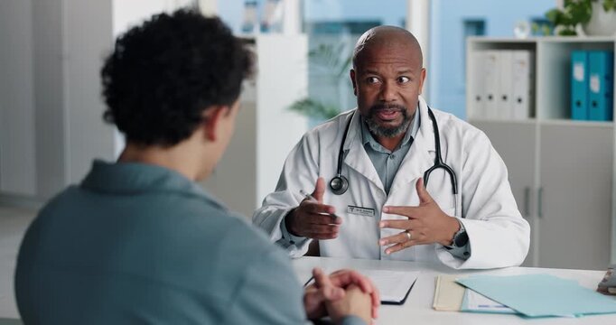 Hospital, talking and doctor with patient for medical advice, visit or healthcare appointment. Discussion, professional and man with wellness consultation, explaining or checklist of diagnosis