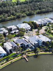 Fototapeta premium Aerial View of Modern Waterfront Homes in Emerald Lakes Gold Coast