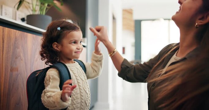 Education, mother and child with high five, backpack and love for learning, support or back to school. Happy family, woman and girl in kitchen for morning routine and study motivation in home