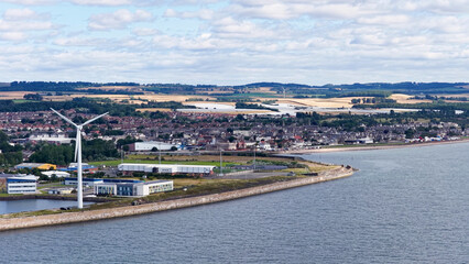 Obraz premium Aerial View of a Wind Turbine on the Dundee Coastal Waterfront