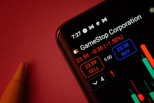 Dhaka, Bangladesh- 08 Sep 2025: Close-up of a phone screen showing GameStop Corp stock market data with a candlestick chart.