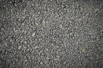 Fototapeta premium Close up texture of dark grey asphalt paving background surface