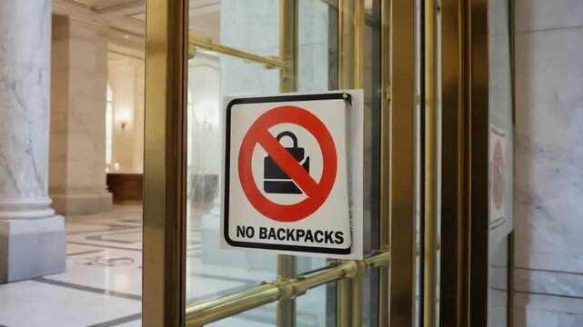 No backpacks allowed sign.