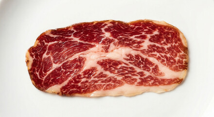 Obraz premium Single perfect raw Iberico ham slice with marbling detail