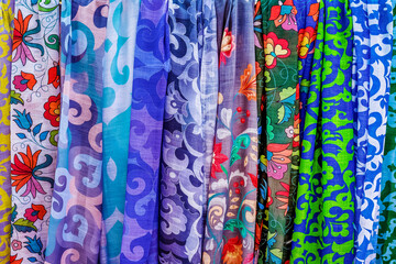 Fototapeta premium The sale of colorful women's kerchiefs at a street festival.