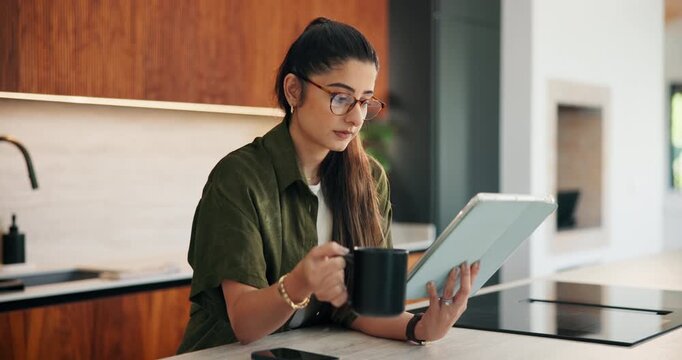Remote work, coffee and woman with tablet in kitchen for story review, draft editing or online news. Hot beverage, freelance editor and tech in home for proofreading, article grammar and reading blog