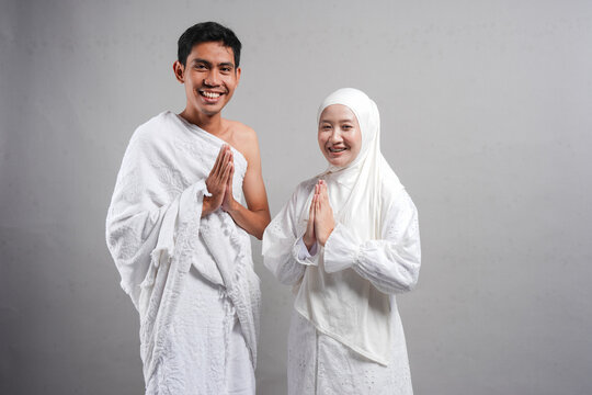 muslim pilgrims wife and husband wearing white traditional clothes for Ihram ready for Hajj, Hajj concept. concep islam muslim concept