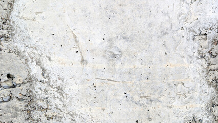 Light gray concrete wall background presenting a rough and uneven texture with small holes, subtle cracks, and gritty aggregates, ideal for creating grunge or industrial design elements © Newleks