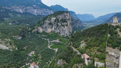 Fototapeta premium Majestic mountain landscape with lush vineyards nestled in the valleys of northern Italy during a serene autumn afternoon