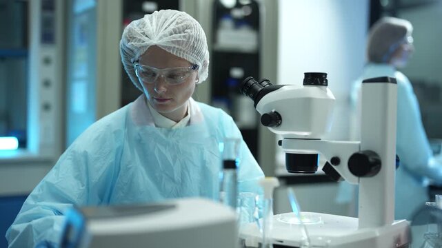 Environmental scientist testing water quality sample for microplastics and chemical contaminants in laboratory.